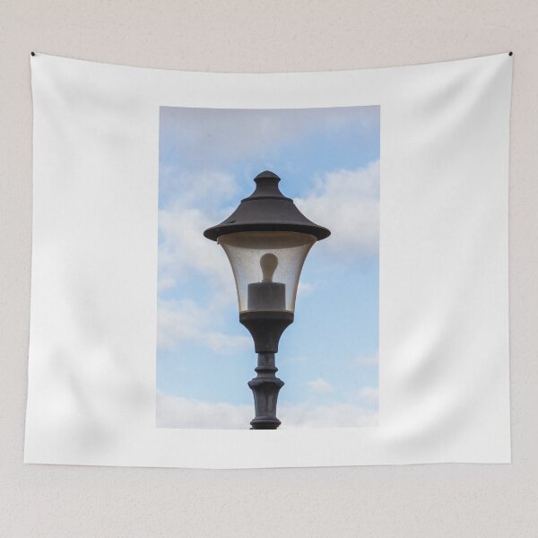 Item preview, Vintage Street Lamp Lantern With Bulb Against Blue Sky And Soft White Clouds designed and sold by Nmallia.