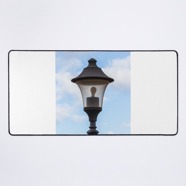 Item preview, Vintage Street Lamp Lantern With Bulb Against Blue Sky And Soft White Clouds designed and sold by Nmallia.