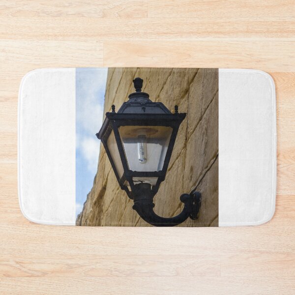 Item preview, Vintage Black Street Lamp Mounted on Textured Stone Wall, Outdoor Architectural Lantern Detail designed and sold by Nmallia.