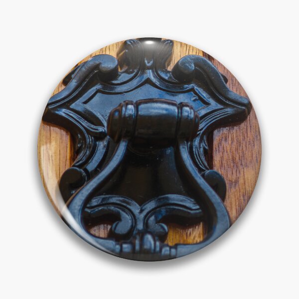 Item preview, Antique Black Metal Door Knocker On Warm Wooden Door Panel With Ornate Decorative Details designed and sold by Nmallia.