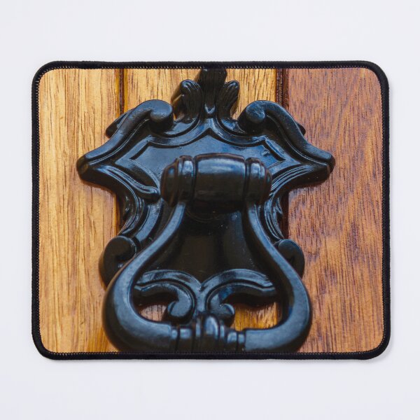 Item preview, Antique Black Metal Door Knocker On Warm Wooden Door Panel With Ornate Decorative Details designed and sold by Nmallia.