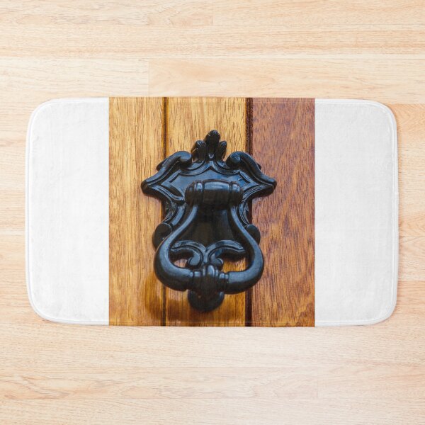 Item preview, Antique Black Metal Door Knocker On Warm Wooden Door Panel With Ornate Decorative Details designed and sold by Nmallia.