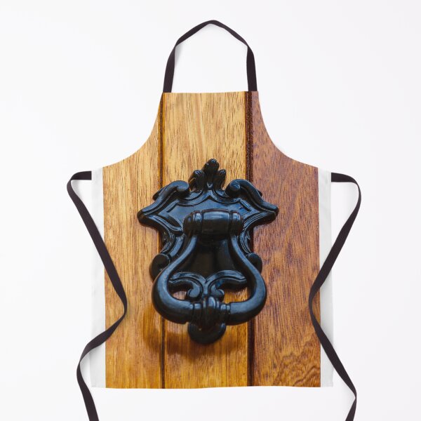 Item preview, Antique Black Metal Door Knocker On Warm Wooden Door Panel With Ornate Decorative Details designed and sold by Nmallia.