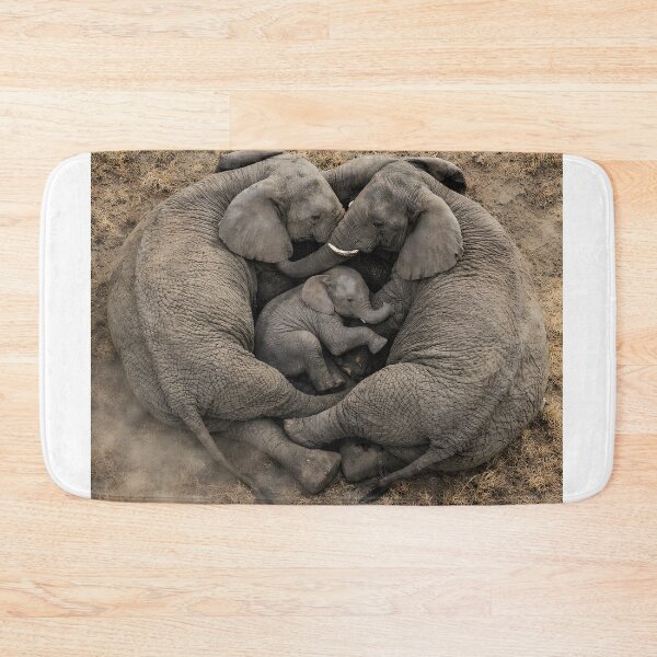 Item preview, Elephant family forms a protective heart around their baby from above designed and sold by Fotografin1981.