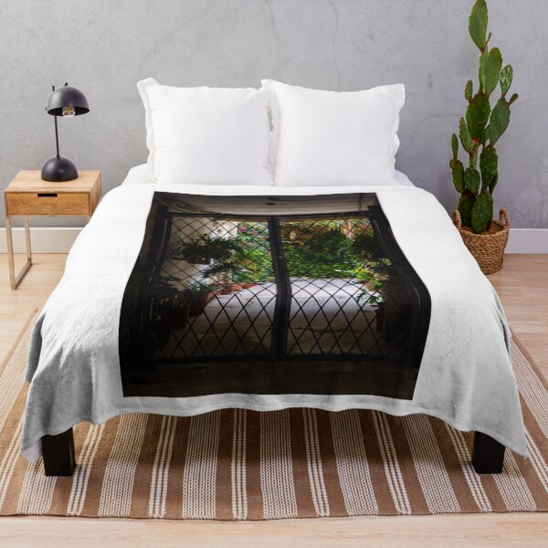 Item preview, Wrought Iron Gate Framing Sunlit Courtyard Garden With Potted Plants And Lush Foliage designed and sold by Nmallia.