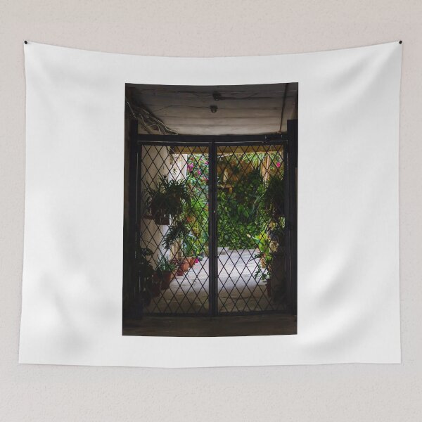Item preview, Wrought Iron Gate Framing Sunlit Courtyard Garden With Potted Plants And Lush Foliage designed and sold by Nmallia.