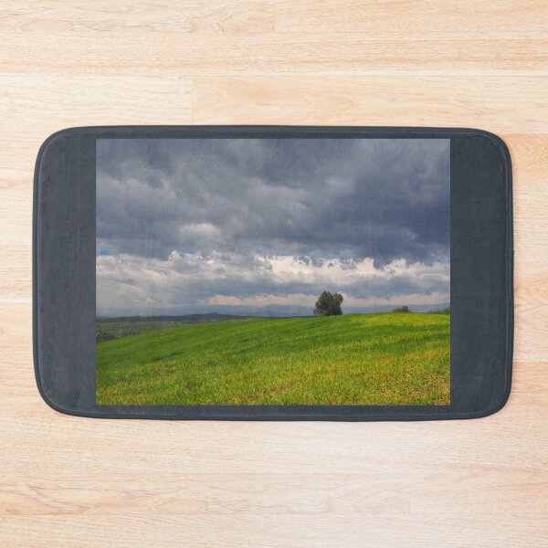Item preview, Dramatic Storm Clouds Over a Green Meadow Landscape designed and sold by onubi.