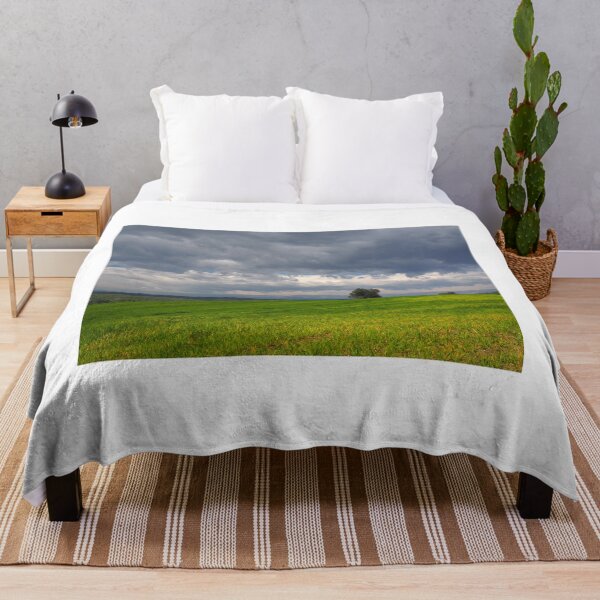 Item preview, Dramatic Storm Clouds Over a Green Meadow Landscape designed and sold by onubi.