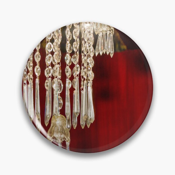 Item preview, Crystal Chandelier Detail With Hanging Prisms Against Rich Red Theater Curtain designed and sold by Nmallia.