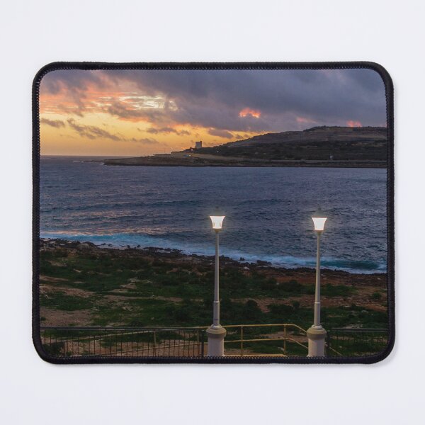 Item preview, Coastal Sunset Over Rocky Shoreline With Lit Lampposts and Distant Headland at Dusk designed and sold by Nmallia.