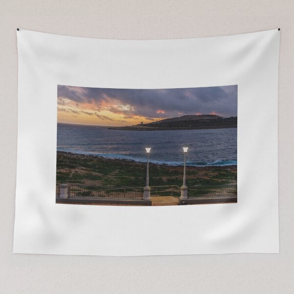 Item preview, Coastal Sunset Over Rocky Shoreline With Lit Lampposts and Distant Headland at Dusk designed and sold by Nmallia.
