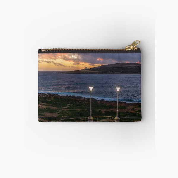 Item preview, Coastal Sunset Over Rocky Shoreline With Lit Lampposts and Distant Headland at Dusk designed and sold by Nmallia.