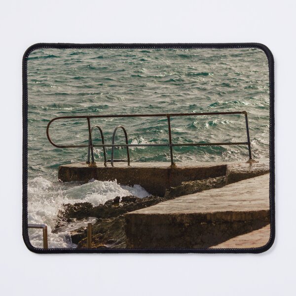 Item preview, Rusty Handrail And Concrete Pier With Ladder Beside Choppy Sea Waves At Coastline designed and sold by Nmallia.