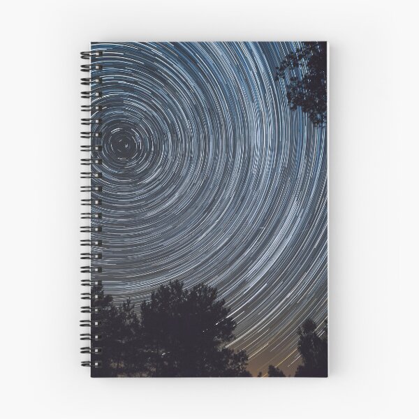 Item preview, Starry night sky, startrails between trees landscape designed and sold by Lukasz Szczepanski.