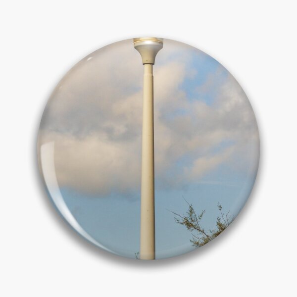 Item preview, Vintage Street Lamp Post Against Blue Sky With Clouds and Tree Branches in Daylight designed and sold by Nmallia.