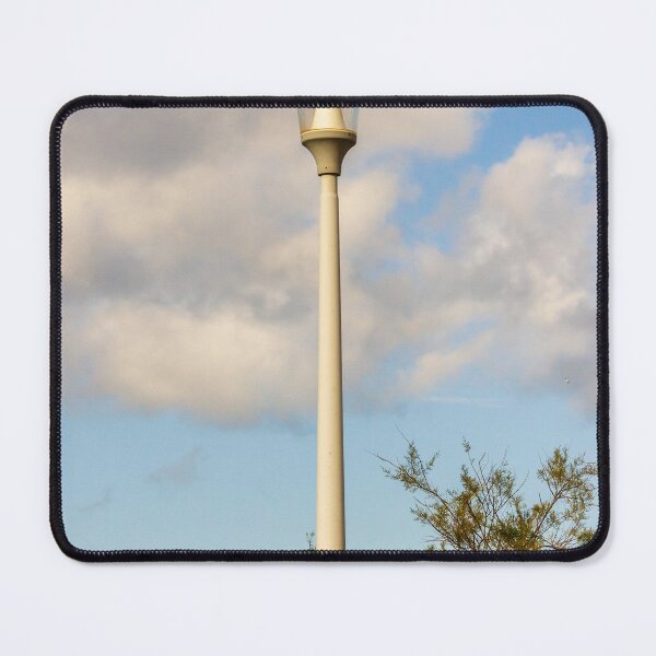 Item preview, Vintage Street Lamp Post Against Blue Sky With Clouds and Tree Branches in Daylight designed and sold by Nmallia.