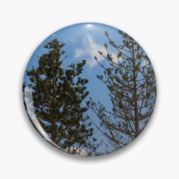 Item preview, Tall Pine Trees Reaching Into A Clear Blue Sky With Scattered White Clouds And Delicate Branches designed and sold by Nmallia.