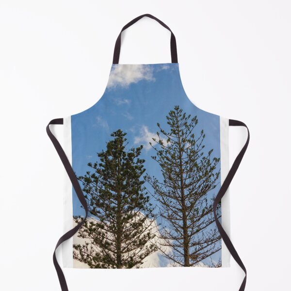 Item preview, Tall Pine Trees Reaching Into A Clear Blue Sky With Scattered White Clouds And Delicate Branches designed and sold by Nmallia.