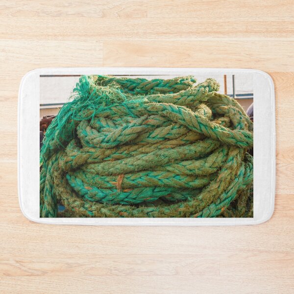 Item preview, Coiled Green Mooring Rope On Fishing Boat Deck With Frayed Fibers And Nautical Texture designed and sold by Nmallia.