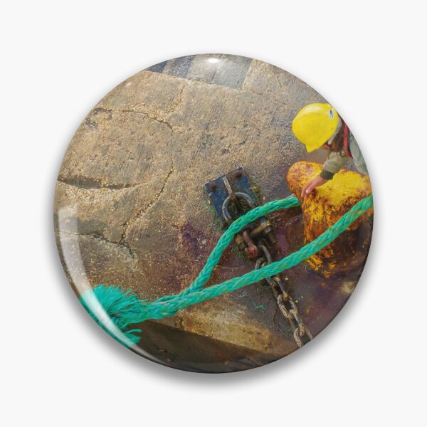 Item preview, Dock Worker Securing Green Mooring Rope To Rusty Bollard On Concrete Pier At Harbor designed and sold by Nmallia.