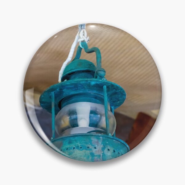 Item preview, Vintage Hanging Lantern With Patina Finish Suspended From Chain Against Textured Ceiling designed and sold by Nmallia.
