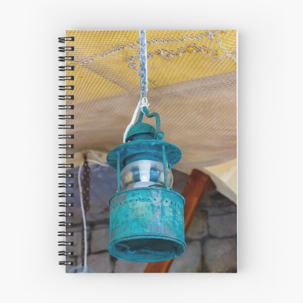 Item preview, Vintage Hanging Lantern With Patina Finish Suspended From Chain Against Textured Ceiling designed and sold by Nmallia.