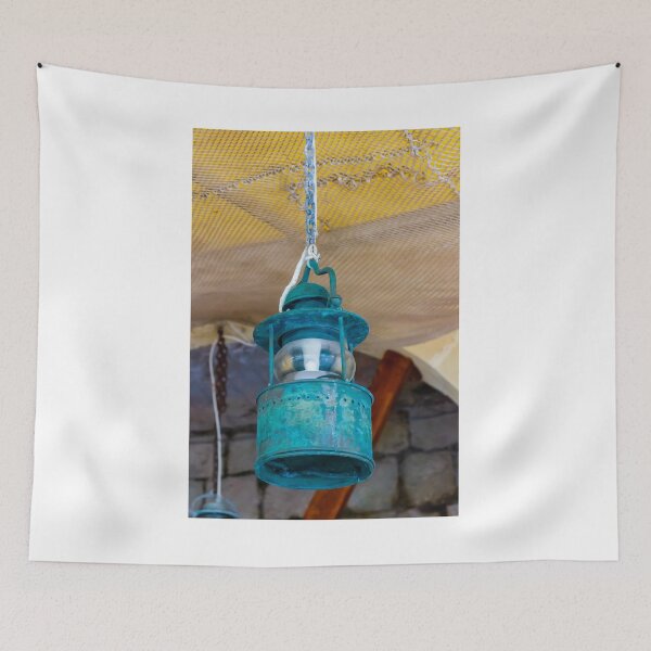 Item preview, Vintage Hanging Lantern With Patina Finish Suspended From Chain Against Textured Ceiling designed and sold by Nmallia.
