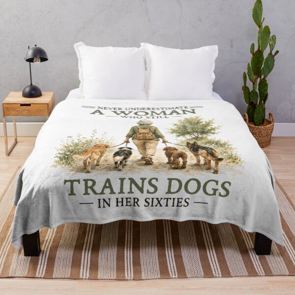 Item preview, Never Underestimate A Woman Who Still Trains Dogs In Her Sixties designed and sold by BoldThreadLab.