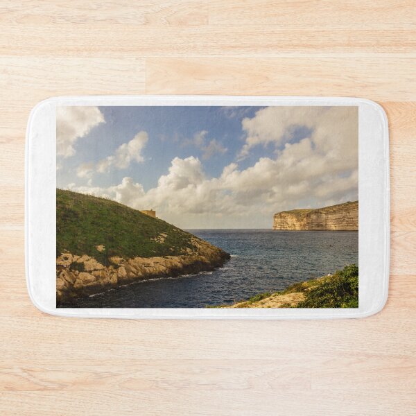 Item preview, Dramatic Coastal Cliffs and Green Headland Overlooking a Calm Blue Bay Under Cloudy Sky designed and sold by Nmallia.