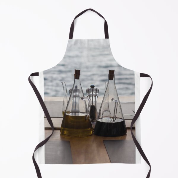 Item preview, Glass Oil And Vinegar Bottles On A Seaside Restaurant Table With Pepper Mill designed and sold by Nmallia.