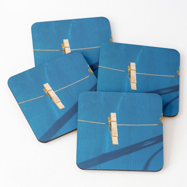 Item preview, Yellow Clothespins On Clothesline Casting Strong Shadows Against Bright Blue Wall Minimal Composition designed and sold by Nmallia.