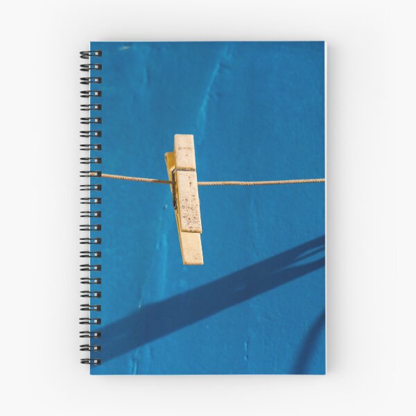 Item preview, Yellow Clothespins On Clothesline Casting Strong Shadows Against Bright Blue Wall Minimal Composition designed and sold by Nmallia.