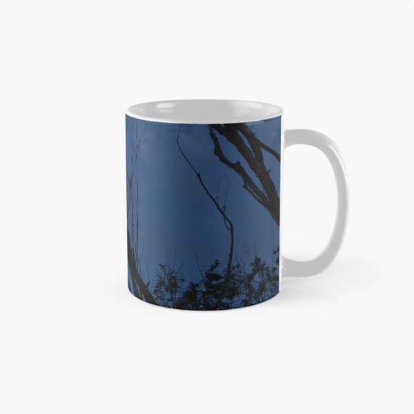 Item preview, Moon framed between tree branches in twilight designed and sold by lisavonbiela.
