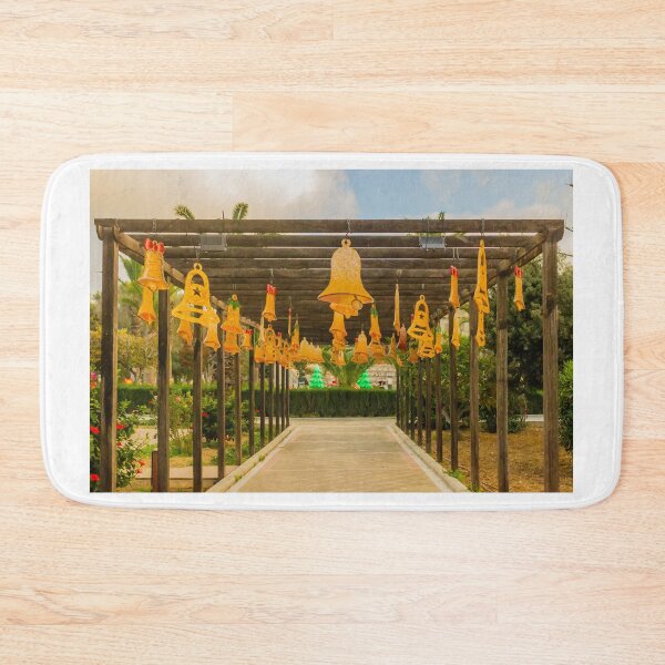 Item preview, Festive Yellow Bells Hanging From Pergola Over Park Walkway With Christmas Decorations designed and sold by Nmallia.