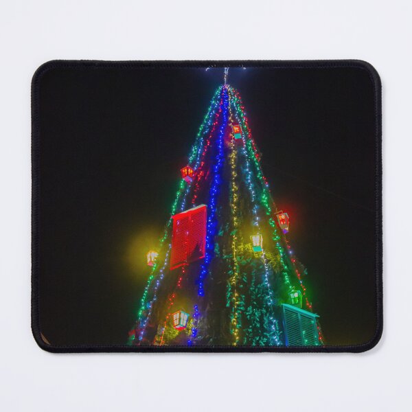 Item preview, Colorful Christmas Tree With Star Topper and Multicolored Lights Decorating City Square At Night designed and sold by Nmallia.