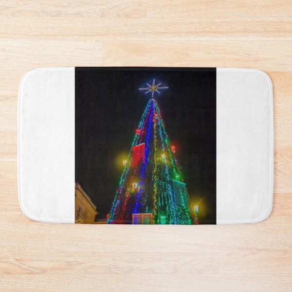 Item preview, Colorful Christmas Tree With Star Topper and Multicolored Lights Decorating City Square At Night designed and sold by Nmallia.