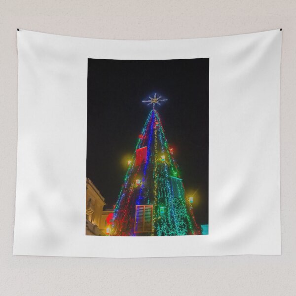 Item preview, Colorful Christmas Tree With Star Topper and Multicolored Lights Decorating City Square At Night designed and sold by Nmallia.