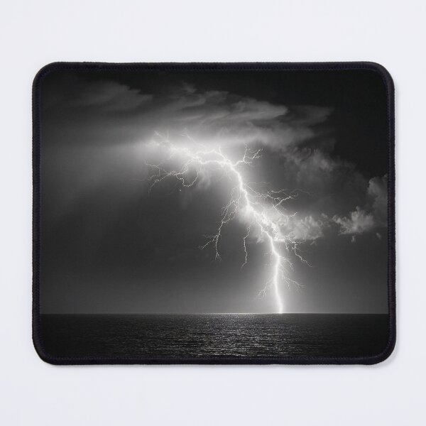 Item preview, Ocean lightning strike fine art photograph of a lightning bolt striking over a dark sea black and white photograph art print designed and sold by Astrid Arkhangelsky.