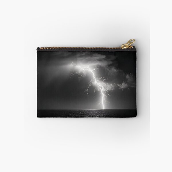 Item preview, Ocean lightning strike fine art photograph of a lightning bolt striking over a dark sea black and white photograph art print designed and sold by Astrid Arkhangelsky.