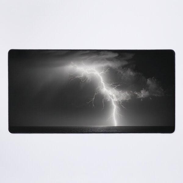 Item preview, Ocean lightning strike fine art photograph of a lightning bolt striking over a dark sea black and white photograph art print designed and sold by Astrid Arkhangelsky.