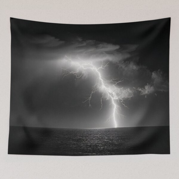 Item preview, Ocean lightning strike fine art photograph of a lightning bolt striking over a dark sea black and white photograph art print designed and sold by Astrid Arkhangelsky.