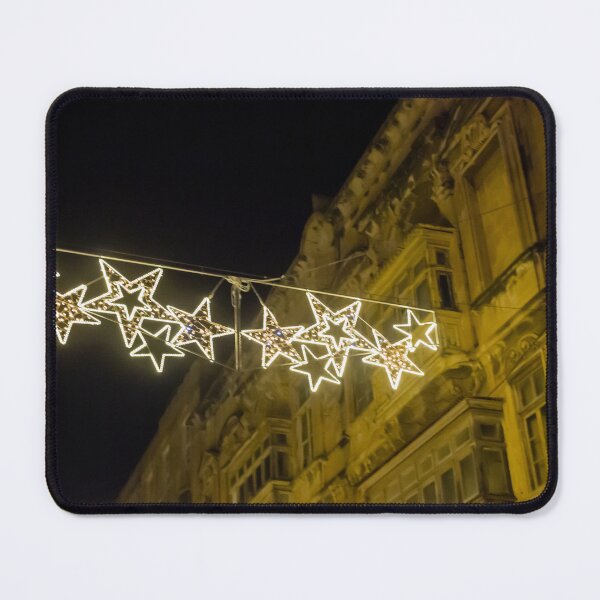 Item preview, Christmas Star Street Lights Hanging Above Historic Building Facade at Night Holiday Decoration designed and sold by Nmallia.
