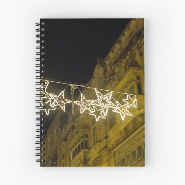 Item preview, Christmas Star Street Lights Hanging Above Historic Building Facade at Night Holiday Decoration designed and sold by Nmallia.
