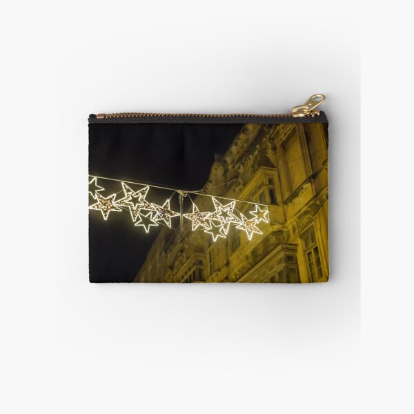 Item preview, Christmas Star Street Lights Hanging Above Historic Building Facade at Night Holiday Decoration designed and sold by Nmallia.