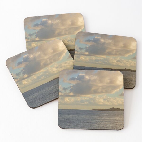 Item preview, Calm Ocean Horizon With Cloud-Filled Sky and Distant Coastal Island at Golden Hour designed and sold by Nmallia.