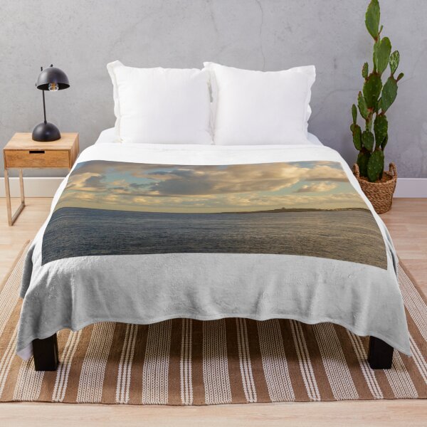 Item preview, Calm Ocean Horizon With Cloud-Filled Sky and Distant Coastal Island at Golden Hour designed and sold by Nmallia.