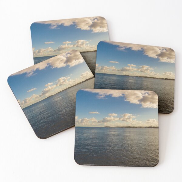 Item preview, Calm Ocean Horizon With Cloud-Filled Sky and Distant Coastal Island at Golden Hour designed and sold by Nmallia.