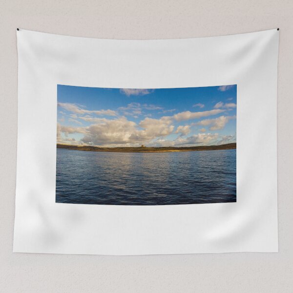 Item preview, Calm Ocean Horizon With Cloud-Filled Sky and Distant Coastal Island at Golden Hour designed and sold by Nmallia.