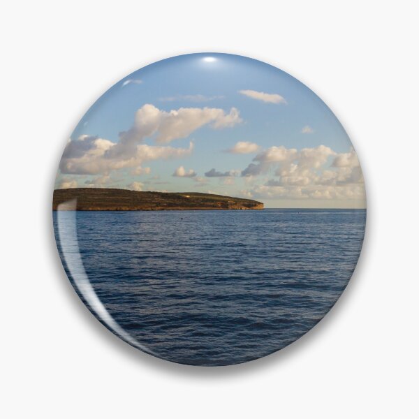 Item preview, Calm Ocean Horizon With Cloud-Filled Sky and Distant Coastal Island at Golden Hour designed and sold by Nmallia.