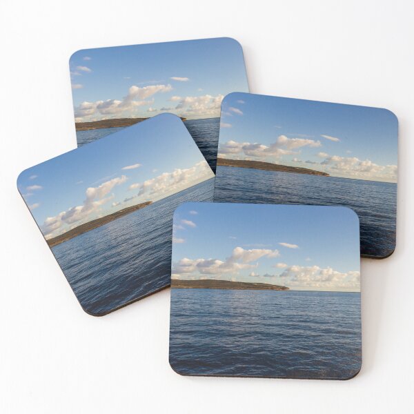 Item preview, Calm Ocean Horizon With Cloud-Filled Sky and Distant Coastal Island at Golden Hour designed and sold by Nmallia.